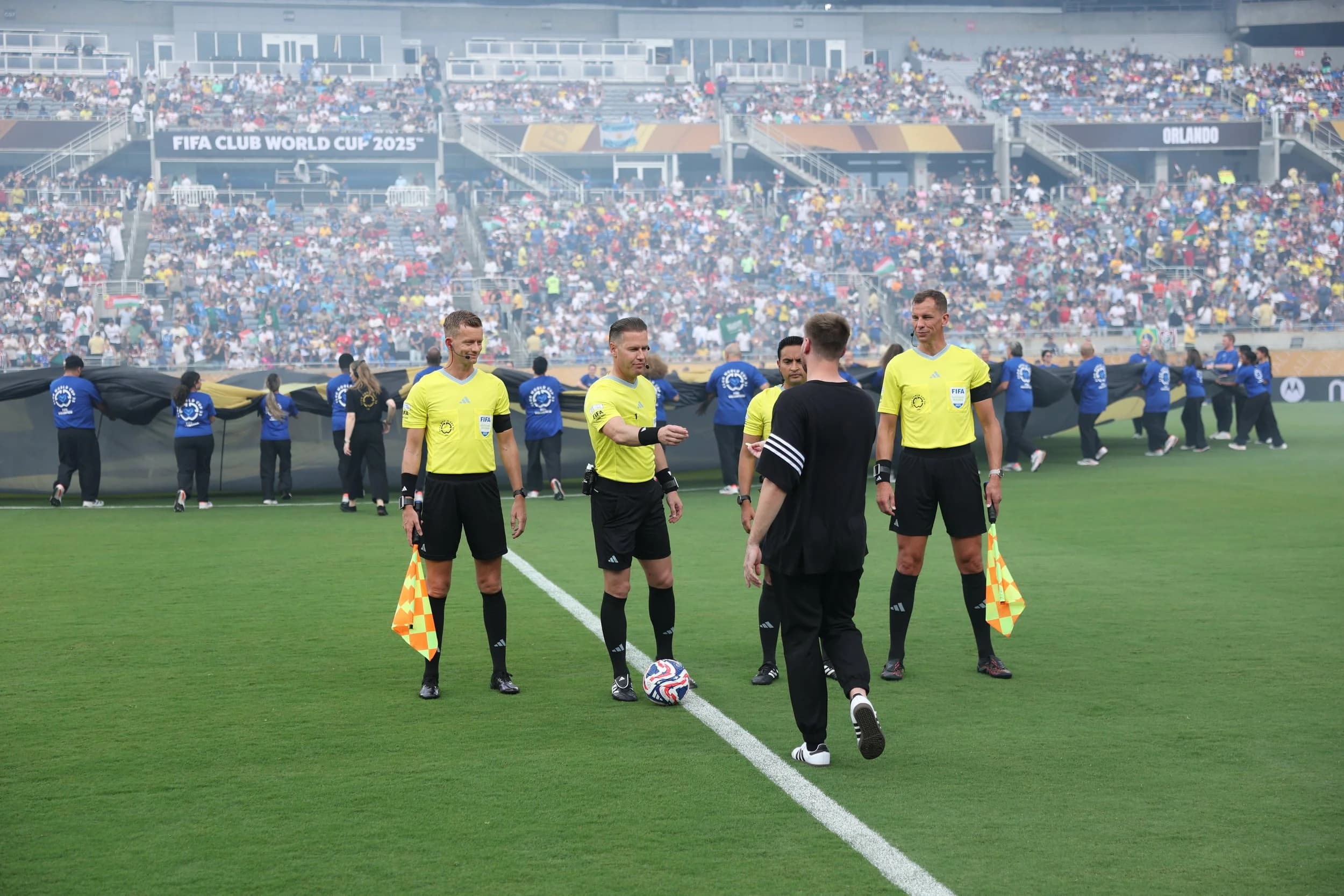 Chummy's Customs delivering coin as Coca-Cola official coin toss assistant