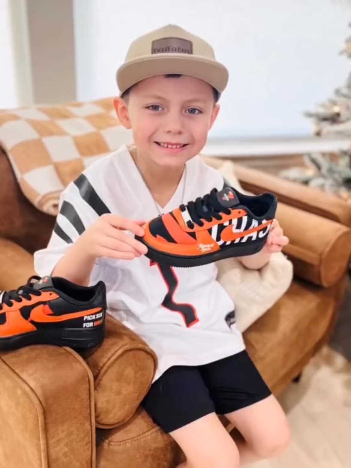 Ja'Marr Chase fan holding Chummy's Customs in collaboration with 7-Eleven